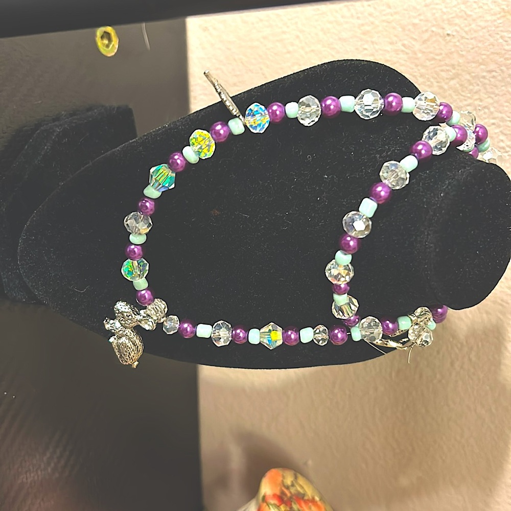 Handmade luxury beaded necklace w sterling silver pendant and charms.